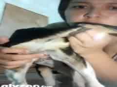 Teen from Brazil playing with her furry friend.